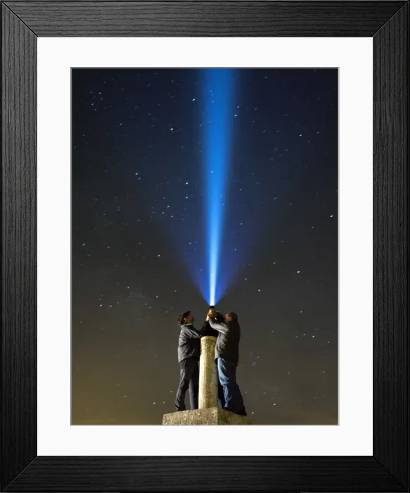 Framed Print : Men with his close hands illuminating the night sky with a bundle of light Framed Print : Men with his close hands illuminating the night sky with a bundle of light