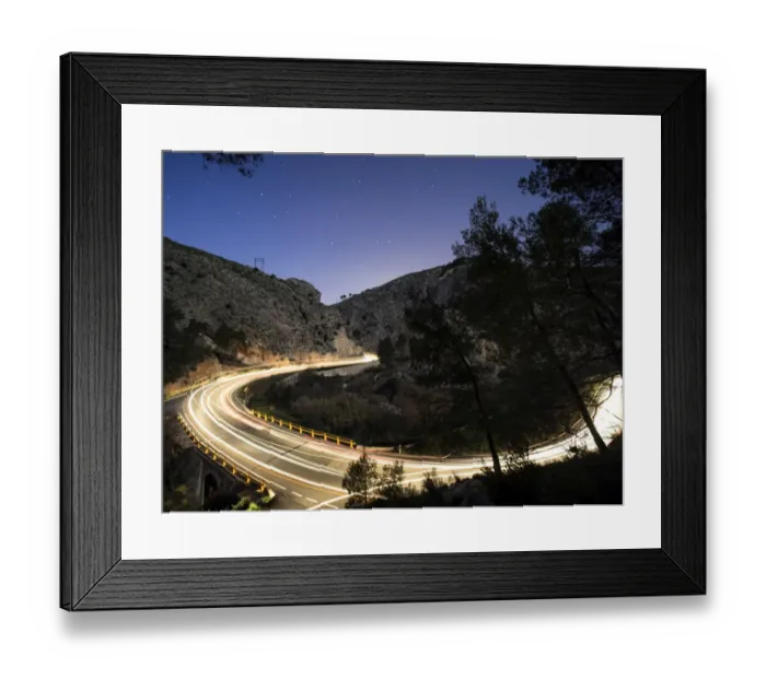 Framed Print : Lights of vehicles circulating along a road with curves during the night Framed Print : Lights of vehicles circulating along a road with curves during the night
