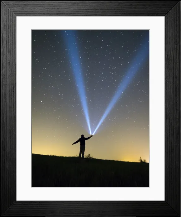 Framed Print : Silhouette of a man doing signs with a lantern on the horizon in the night Framed Print : Silhouette of a man doing signs with a lantern on the horizon in the night