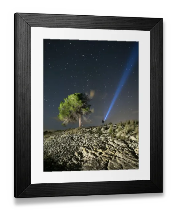 Framed Print : Person lighting the sky with a flashlight Framed Print : Person lighting the sky with a flashlight