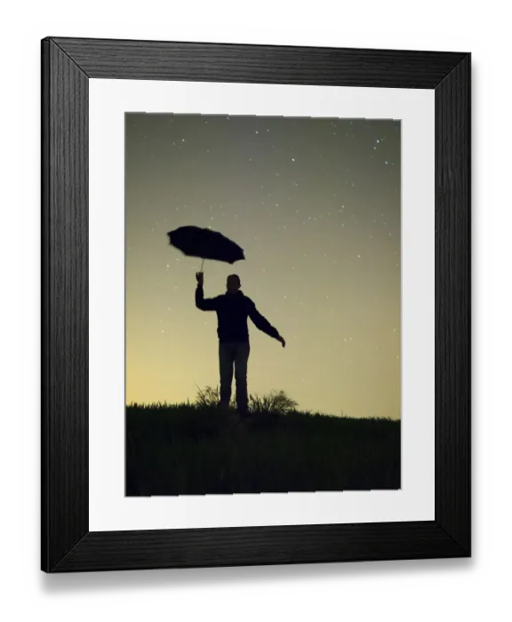 Framed Print : Silhouette of a man with an umbrella in the night Framed Print : Silhouette of a man with an umbrella in the night