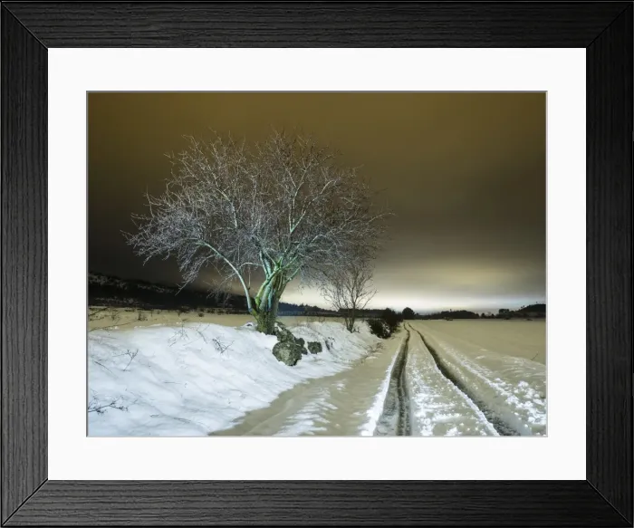 Framed Print : Cut road covered of snow close to a few fields in the night Framed Print : Cut road covered of snow close to a few fields in the night