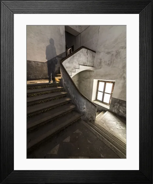 Framed Print : Ancient spiral stairs with a human shade Framed Print : Ancient spiral stairs with a human shade