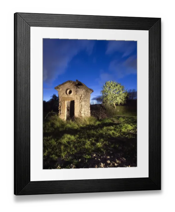 Framed Print : Shed of ancient stone of a well at dusk Framed Print : Shed of ancient stone of a well at dusk