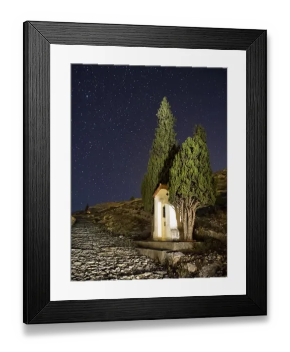 Framed Print : Old cobblestone road with a booth and cypresses Framed Print : Old cobblestone road with a booth and cypresses