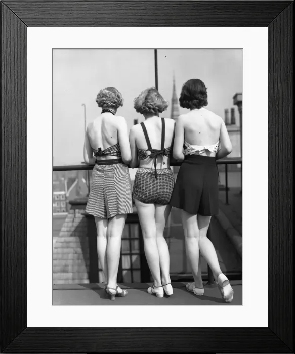 Framed Print : Good View. 1st April 1935: Three models wearing two-piece swimsuits with tailored shorts
