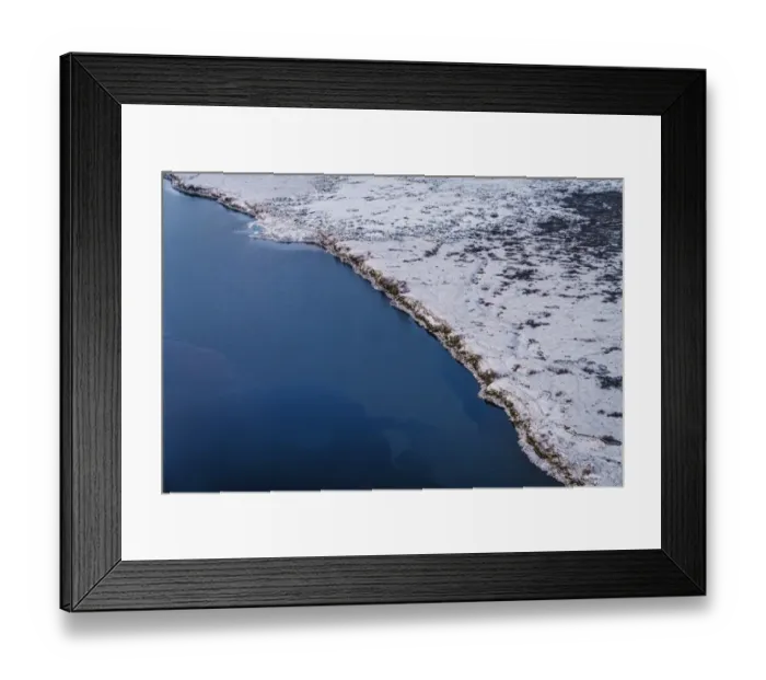 Framed Print : Aerial view of coastline and snow covered lava fields, Iceland Framed Print : Aerial view of coastline and snow covered lava fields, Iceland
