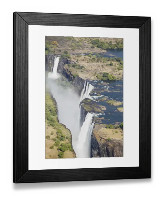 Framed Print : Zambezi River flowing over Victoria Falls, aerial view