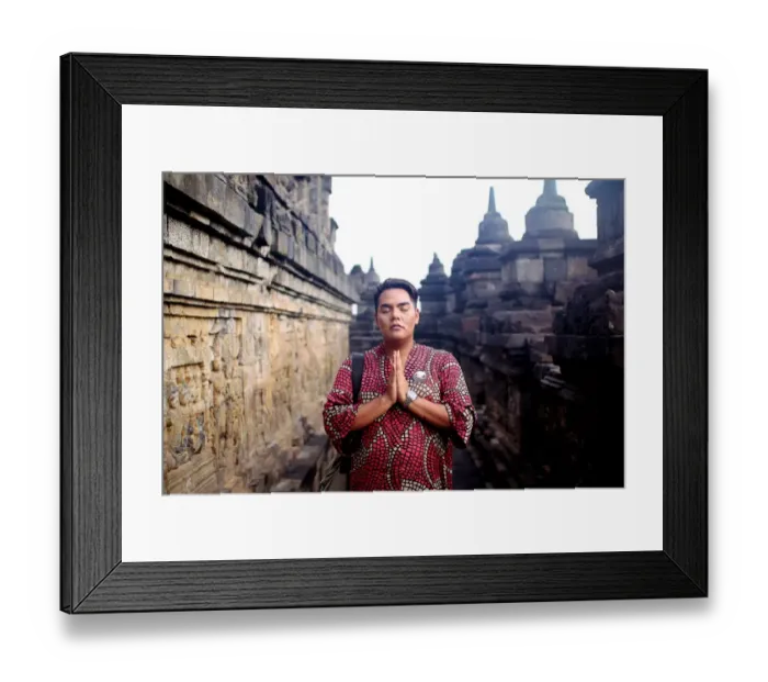 Framed Print : Asian man in traditional dress posed at Borobudur temple
