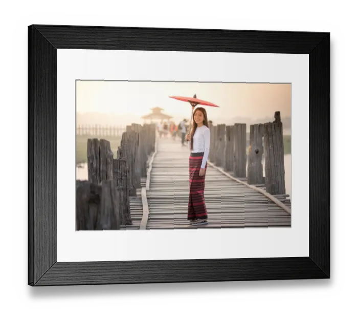 Framed Print : Beautiful woman holding traditional red umbrella and walking on U Bein Bridge, Myanmar