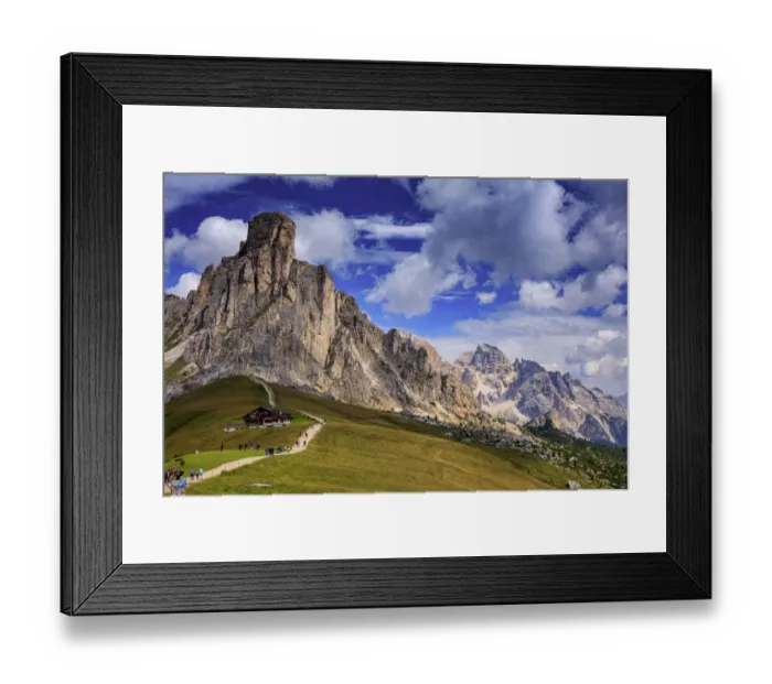 Framed Print : Giau Pass. Tourists walking towards a hut at Giau pass