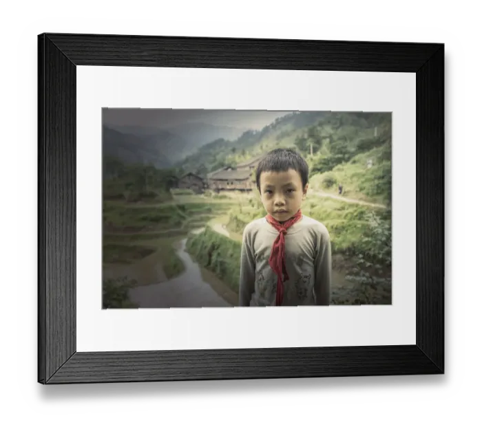 Framed Print : Chinese boy standing in rice paddy fields