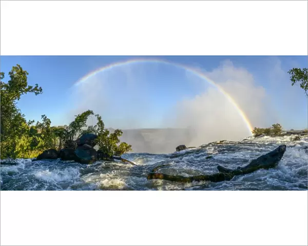 The Zambezi River and rainbow just above The Eastern Cataract. Victoria Falls. Livingstone. Zambia
