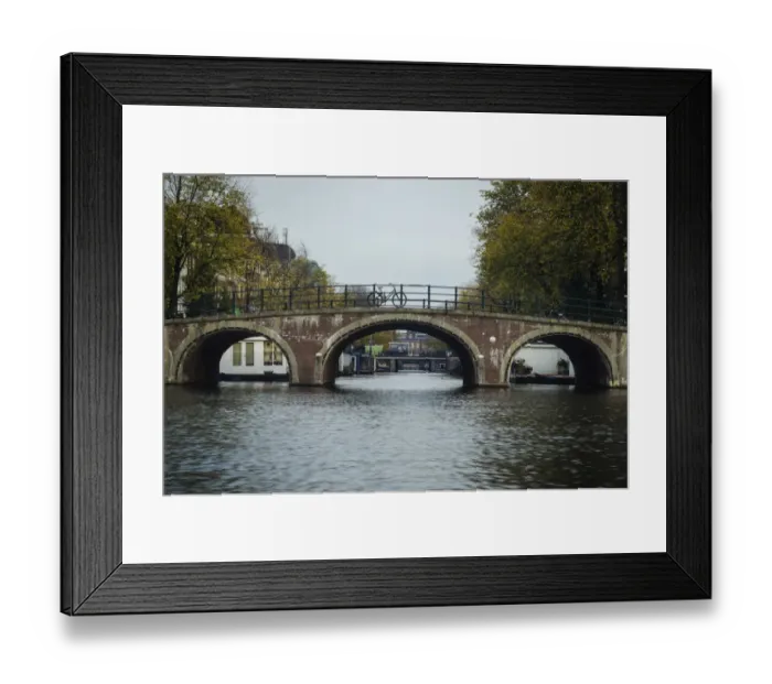 Framed Print : A Canal Bridge in the Capital City of Amsterdam, Netherlands Framed Print : A Canal Bridge in the Capital City of Amsterdam, Netherlands