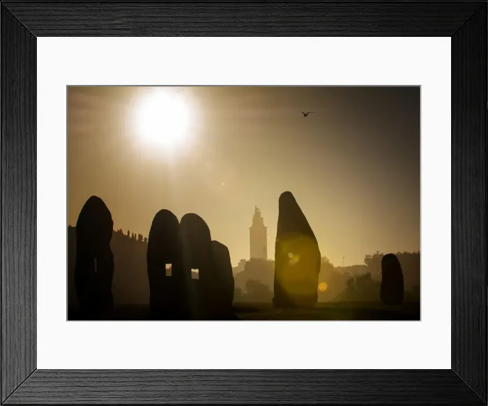 Framed Print : Young woman jumping in midair outdoors, in front of Hercules Tower, A Coruna, Spain