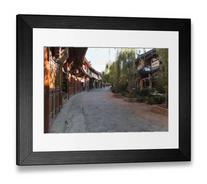 Framed Print : Panoramic view of Lijiang Old Town at sunset and some tourists walking by Framed Print : Panoramic view of Lijiang Old Town at sunset and some tourists walking by