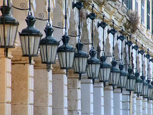 The arcades and traditional lanterns of the famous Liston at the Spianada in Kerkyra, Corfu Town, Greece