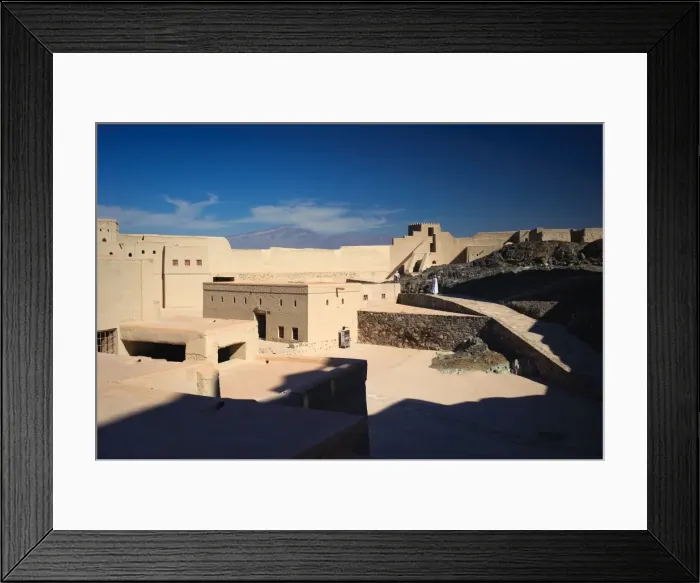Framed Print : Father and son exploring the main courtyard of Bahla Fort, Oman Framed Print : Father and son exploring the main courtyard of Bahla Fort, Oman
