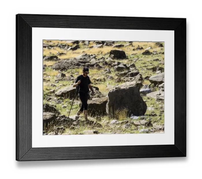 Framed Print : Hiker walking with a stick by a mountain area of Gavarnie Framed Print : Hiker walking with a stick by a mountain area of Gavarnie