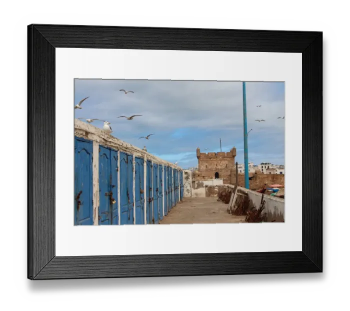 Framed Print : Fishermens huts and Genoese-built citadel in Essaouira harbour, on Atlantic coast of Morocco