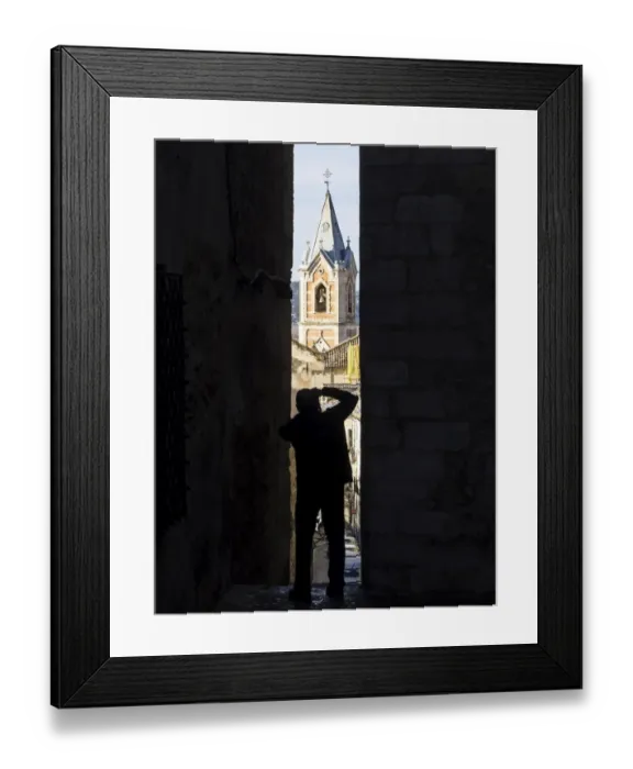 Framed Print : Silhouette of a person extracting a photo in a narrow alley Framed Print : Silhouette of a person extracting a photo in a narrow alley