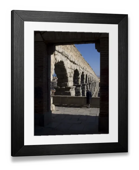 Framed Print : Elderly woman looking at the aqueduct of Segovia Framed Print : Elderly woman looking at the aqueduct of Segovia