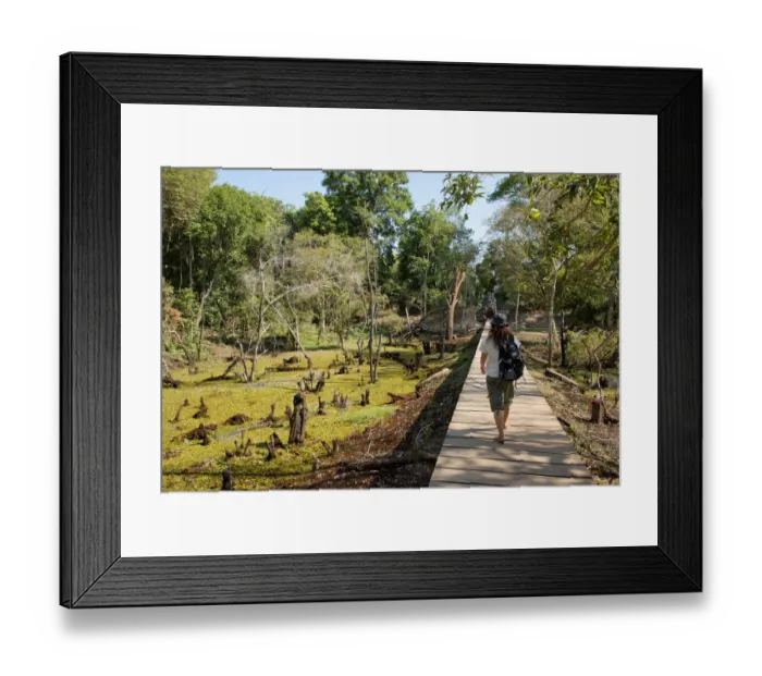 Framed Print : Woman on walkway at Neak Pean, Angkor, Cambodia Framed Print : Woman on walkway at Neak Pean, Angkor, Cambodia