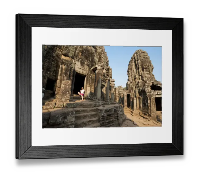 Framed Print : Woman standing in stone doorway of Bayon Temple Framed Print : Woman standing in stone doorway of Bayon Temple