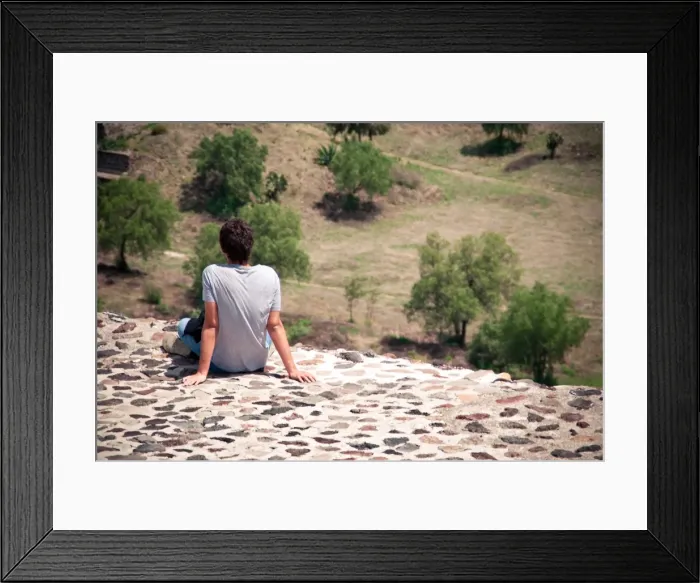 Framed Print : Young man relaxing on a pyramid in Teotihuacan Framed Print : Young man relaxing on a pyramid in Teotihuacan