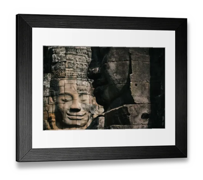 Framed Print : Faces of the sculptures in Bayon temple, Angkor Thom, Cambodia