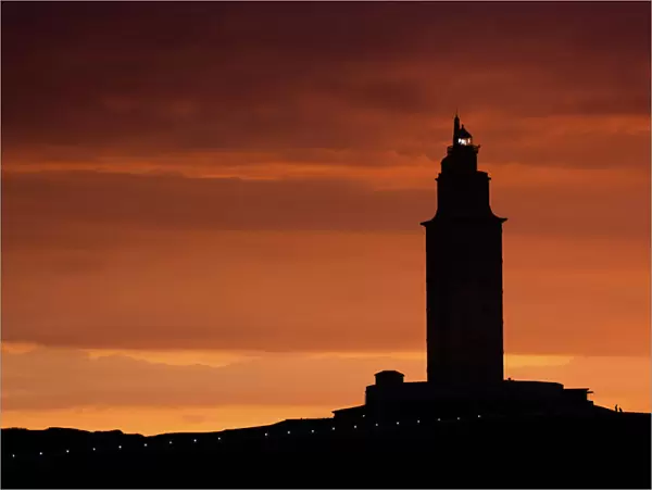 Silhouette of Hercules Tower at orange sunset