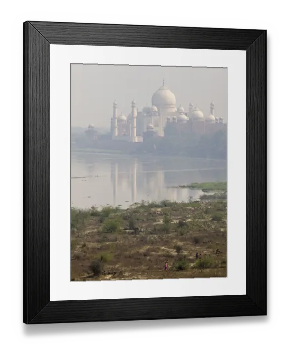 Framed Print : Taj Mahal. A view of Taj Mahal from Yamuna river where some people are walking Framed Print : Taj Mahal. A view of Taj Mahal from Yamuna river where some people are walking