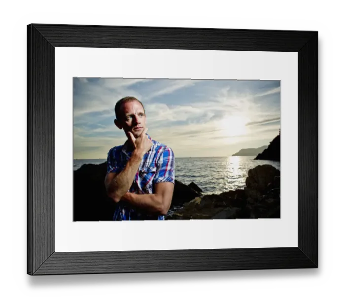Framed Print : A Young Man Stands On The Shore During A Sunset Over The Mediterranean