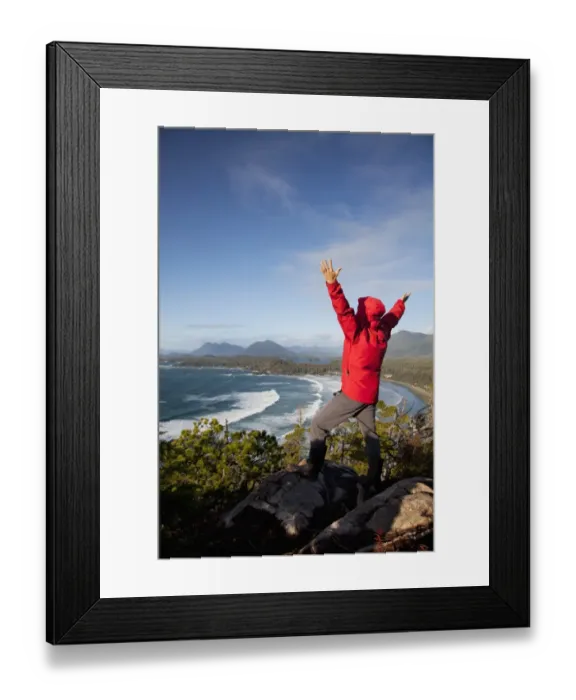 Framed Print : A Man Wearing A Red Jacket Looks Out At The View Of Cox Bay Near Tofino With Arms Raised Framed Print : A Man Wearing A Red Jacket Looks Out At The View Of Cox Bay Near Tofino With Arms Raised