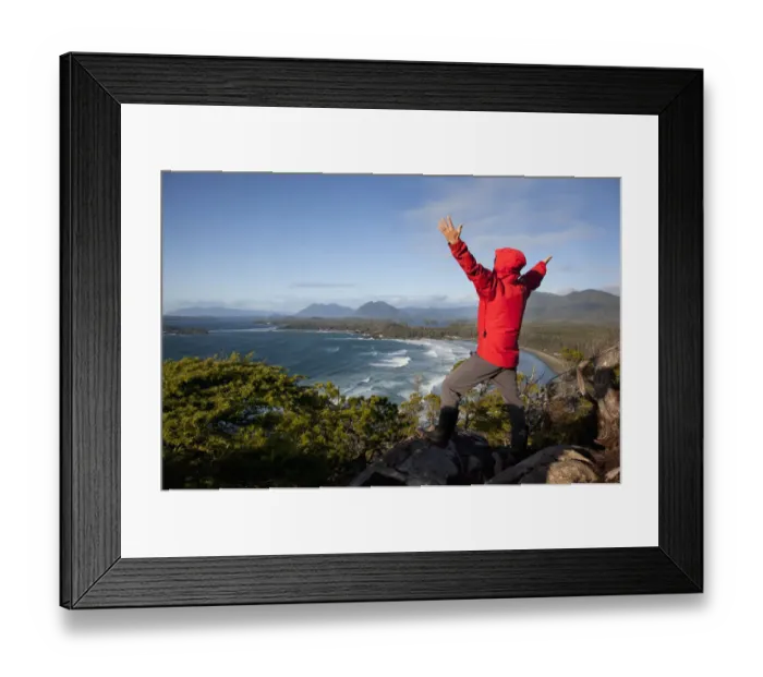 Framed Print : A Man Wearing A Red Jacket Looks Out At The View Of Cox Bay Near Tofino With Arms Raised Framed Print : A Man Wearing A Red Jacket Looks Out At The View Of Cox Bay Near Tofino With Arms Raised