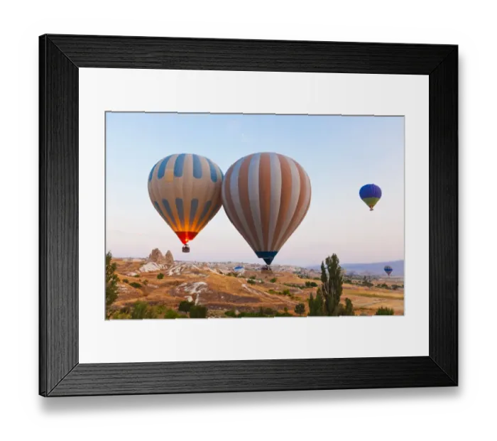 Framed Print : Hot air balloon flying over Cappadocia Turkey Framed Print : Hot air balloon flying over Cappadocia Turkey
