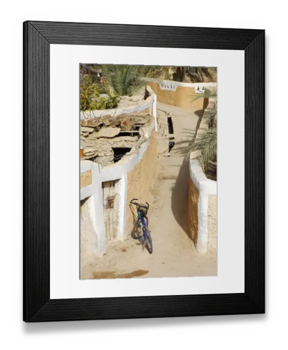 Framed Print : Modern bike parking in a lane in the Old town of Ghadames, UNESCO world heritage, Libya