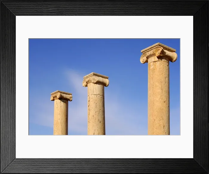 Framed Print : Ancient columns iwith ionic capital, ruins of the Roman City Leptis Magna, Libya Framed Print : Ancient columns iwith ionic capital, ruins of the Roman City Leptis Magna, Libya