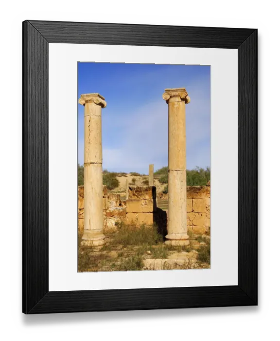 Framed Print : Ancient columns iwith ionic capital, ruins of the Roman City Leptis Magna, Libya Framed Print : Ancient columns iwith ionic capital, ruins of the Roman City Leptis Magna, Libya