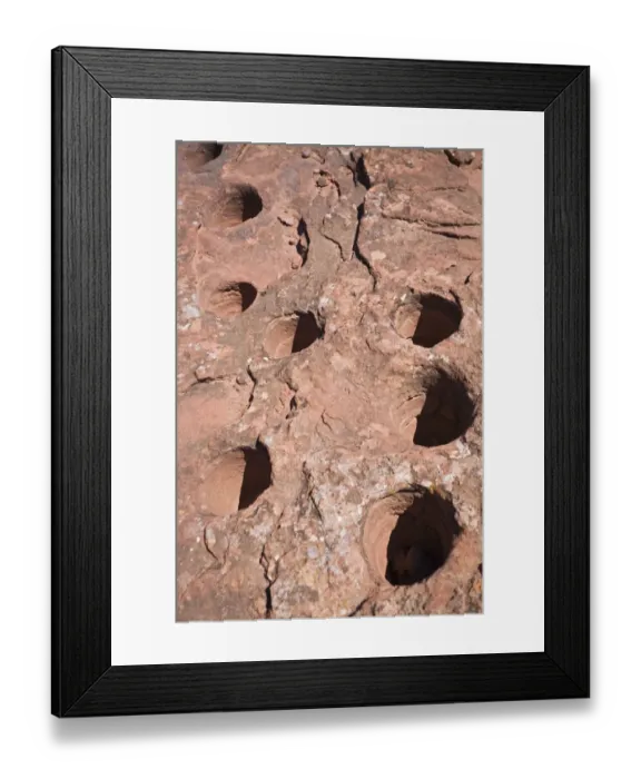 Framed Print : Stone panel with holes from the original inhabitants in the national park, Parque Nacional Talampaya, Argentina, South America Framed Print : Stone panel with holes from the original inhabitants in the national park, Parque Nacional Talampaya, Argentina, South America