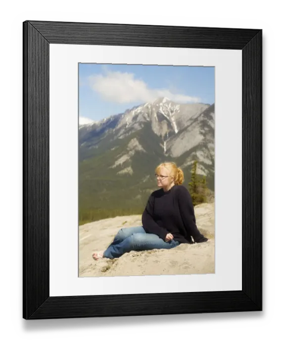 Framed Print : Young woman sitting in the mountains, Jasper, Canada Framed Print : Young woman sitting in the mountains, Jasper, Canada
