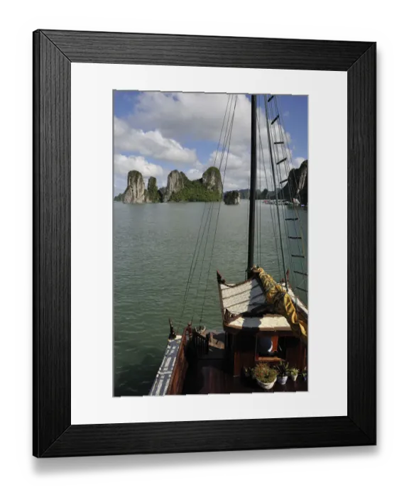 Framed Print : Junk boat navigating in Halong Bay Framed Print : Junk boat navigating in Halong Bay