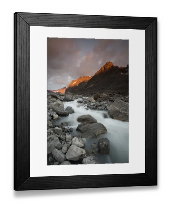Framed Print : Greenland, Itilleq, setting sun lighting mountain peaks above mountain stream along Itilleq Fjord Framed Print : Greenland, Itilleq, setting sun lighting mountain peaks above mountain stream along Itilleq Fjord