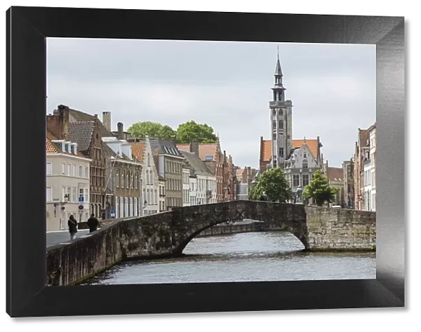 Old stone bridge across the canal in Bruges, West Flanders, Belgium