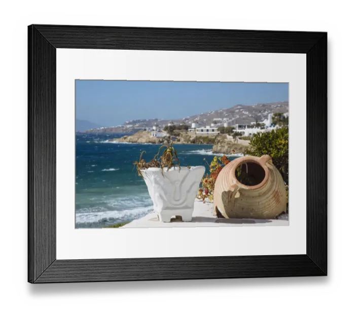 Framed Print : Old flower pots on foreground and Mykonos town and Aegean sea in the background, Cyclades, Greece