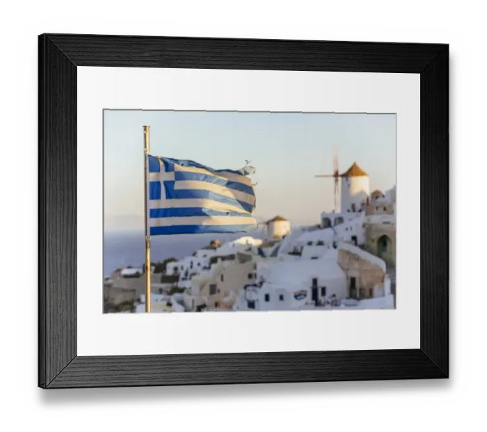 Framed Print : Oia village in Santorini and flag of Greece Framed Print : Oia village in Santorini and flag of Greece
