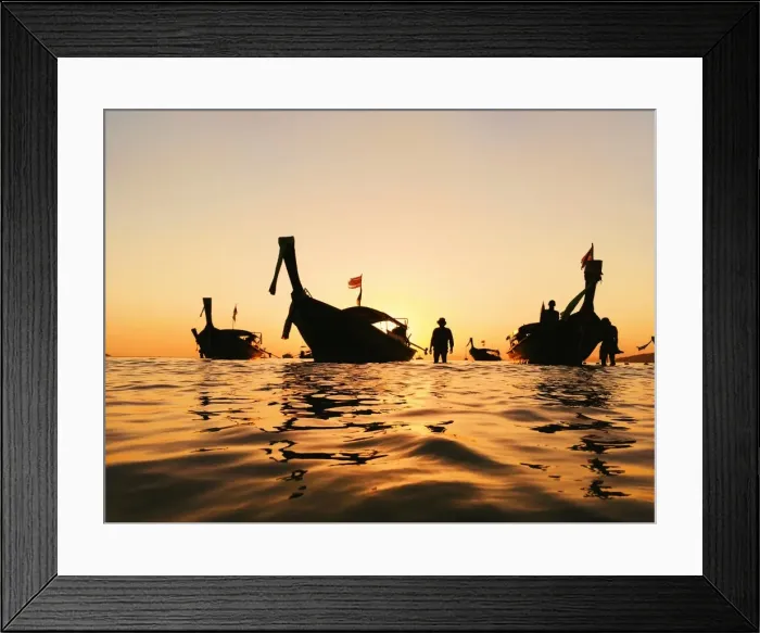 Framed Print : Silhouette of a longtail boat and fisherman at sunset in Krabi, Thailand Framed Print : Silhouette of a longtail boat and fisherman at sunset in Krabi, Thailand