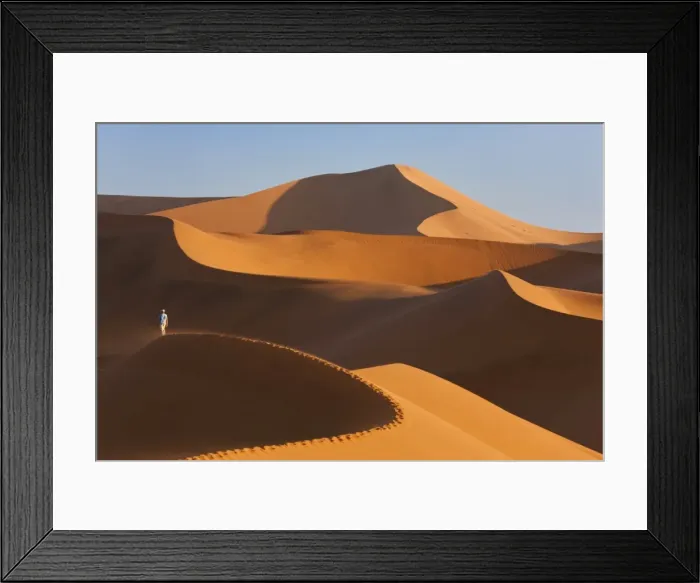 Framed Print : Man Climbing Sand Dunes, Namib Desert, Namibia Framed Print : Man Climbing Sand Dunes, Namib Desert, Namibia