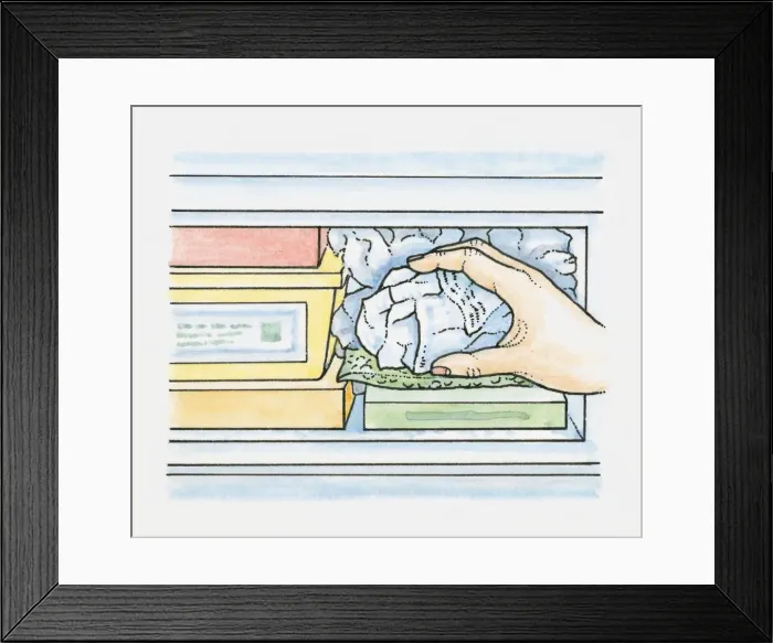 Framed Print : Crumpled newspaper in plastic bags being placed into empty spaces in a freezer to maintain efficient freezing Framed Print : Crumpled newspaper in plastic bags being placed into empty spaces in a freezer to maintain efficient freezing
