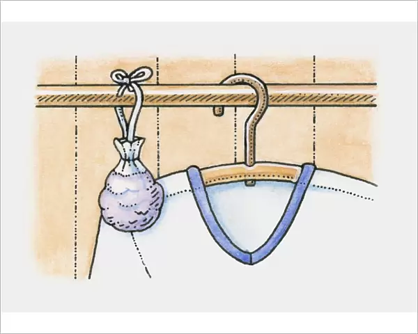 Sachet of lavender hanging on clothes rail in wardrobe, next to a shirt